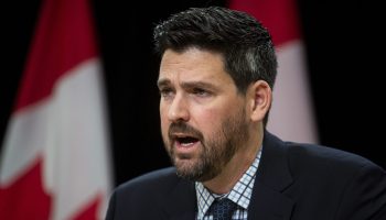 Minister of Housing, Infrastructure and Communities Sean Fraser speaks at a press conference in the National Press theatre on  Dec. 10, 2024. The Hill Times photograph by Andrew Meade