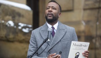 Nicholas Marcus Thompson, president, Black Class Action Secretariat, speaks at a rally outside the Prime Minister’s Office on  Dec. 10, 2024. Hill Times photograph by Andrew Meade
