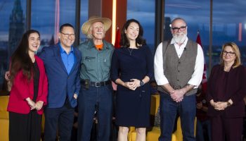 NDP leadership candidates Tanille Johnston, left, Avi Lewis, Tony McQuail, Heather McPherson, Rob Ashton, and CLC president Bea Bruske take a photo before a forum hosted by the Canadian Labour Congress in Ottawa on Oct. 22, 2025. The Hill Times photograph by Andrew Meade