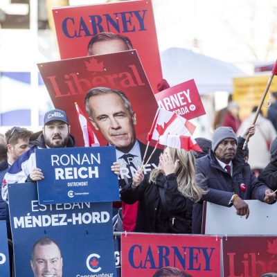 Liberal and Conservative Party supporters gather outside the Federal Leaders debate at La Maison de Radio-Canada in Montréal, Que. on  April 17, 2025.The Hill Times photograph by Andrew Meade