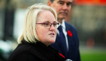 Minister of Veterans Affairs Jill McKnight speaks at the Royal Canadian Legion’s Poppy flag raising on Parliament Hill on  Oct. 31, 2025. The Hill Times photograph by Andrew Meade