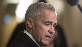 Prime Minister Mark Carney speaks with reporters before the Liberal cabinet meeting in West Block on  Nov. 18, 2025. The Hill Times photograph by Andrew Meade