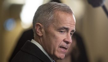 Prime Minister Mark Carney speaks with reporters before the Liberal cabinet meeting in West Block on  Nov. 18, 2025. The Hill Times photograph by Andrew Meade