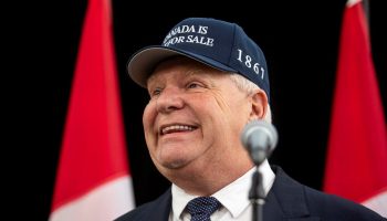 Doug Ford, Premier of Ontario, speaks with reporters as he arrives for the First Ministers Meeting in Ottawa on Jan. 15, 2025, wearing a ‘Canada is Not For Sale’ hat. The Hill Times photograph by Andrew Meade