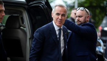 Prime Minister Mark Carney arrives for the Liberal caucus meeting in West Block on May 25, 2025. The Hill Times photograph by Andrew Meade
