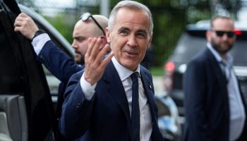 Prime Minister Mark Carney arrives for the Liberal party caucus meeting in West Block on May 25, 2025. The Hill Times photograph by Andrew Meade