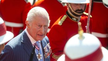 King Charles inspects the honour guard at the Senate of Canada building in Ottawa before delivering the Speech from the Throne on May 27, 2025. The Hill Times photograph by Andrew Meade