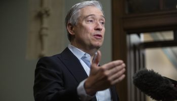 Minister of Innovation, Science and Industry François-Philippe Champagne speaks with reporters before for the Liberal party caucus meeting from West Block  on Jan. 24, 2025. The Hill Times photograph by Andrew Meade