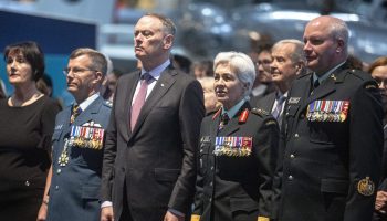 National Defence Minister David McGuinty, centre left, with Chief of Defence Staff Jennie Carignan, centre right, attend the change of command ceremony where Lt.-Gen. Jamie Speiser-Blanchet assumes command of the Royal Canadian Air Force from Lt.-Gen. Eric Kenny at the Canada Aviation and Space Museum on July 10, 2025. The Hill Times photograph by Andrew Meade