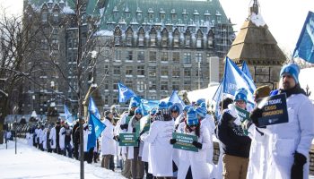 Members of The Professional Institute of the Public Service of Canada hold an action at Parliament Hill  on  Jan. 16, 2026, to denounce the government’s proposed cuts to federal science programs. Photograph by Andrew Meade