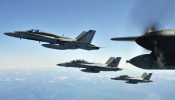 A Royal Canadian Air Force (RCAF) CF-18 Hornet fighter aircraft and two United States Navy F-18 Hornet fighter aircraft fly in formation in blue skies near Canadian Forces Base Comox British Columbia after they each completed an air-to-air refueling with a RCAF CC-130 Hercules on May 6, 2013 during Exercise TRIDENT FURY 13.

 

Photo: Sgt Norm McLean, Canadian Forces Combat Camera