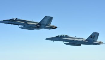 A Royal Canadian Air Force (ARC) CF-18 Hornet fighter aircraft and a United States Navy F-18 Hornet fighter aircraft fly in formation in blue skies over Canadian Forces Base Comox British Columbia, after they each completed an air-to-air refueling with a RCAF CC-130 Hercules on May 6, 2013 during Exercise TRIDENT FURY 13.

 

Photo: Sgt Norm McLean, Canadian Forces Combat Camera