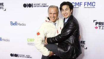 Prime Minister Mark Carney holds Heated Rivalry star Hudson Williams on the Prime Time red carpet on Jan. 29 at the Canadian Media Producers Association's conference. The Hill Times photograph by Sam Garcia