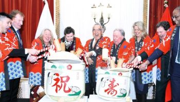 Matt Miwa, left, president of the Ottawa Japanese Community Association; Minister Marc Miller; MP Mona Fortier; Senator Marilou McPhedran; Ambassador Kanji Yamanouchi; former Senator Jim Munson; Laurie Peters, director general for Canada at Expo 2025 Osaka; Supreme Court Chief Justice Richard Wagner; and MP Greg Fergus, then House Speaker, hammer open a pair of sake-filled drums as part of a celebratory Kagami Biraki ceremony to wish Emperor Naruhito a happy 65th birthday on Feb. 11, 2025 at the Château Laurier. The Hill Times photograph by Sam Garcia
