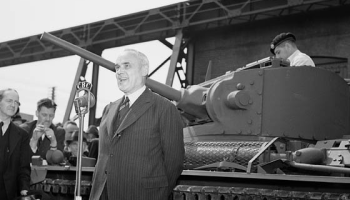 The Hon. C.D. Howe broadcasting on CBC Radio on the occasion of the completion of the first Canadian-built tank, the Cruiser Tank, at Angus Shops, Montreal Locomotive Works, on May 27, 1941. Photograph courtesy of Wikimedia Commons.