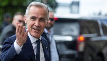 Prime Minister Mark Carney arrives for the Liberal party caucus meeting in West Block on May 25, 2025. The Hill Times photograph by Andrew Meade