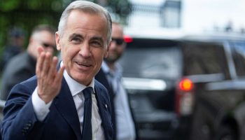 Prime Minister Mark Carney arrives for the Liberal party caucus meeting in West Block on May 25, 2025. The Hill Times photograph by Andrew Meade