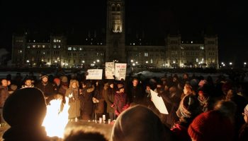 Parliament Hill was home to a vigil on Jan. 30, 2017, where people gathered by the flame to honour the Quebec mosque attack victims. Now, on Jan. 29 Canadians observe the National Day of Remembrance of the Québec City Mosque Attack and Action against Islamophobia. The Hill Times Photograph by Sam Garcia