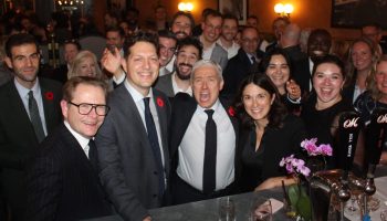 Finance Minister Francois Philippe Champagne, middle, poses for a group at the 'Prudence and Prosecco' post-budget party at the Metropolitain Brasserie on Nov. 4, hosted by Politico and Earnscliffe Strategies.
