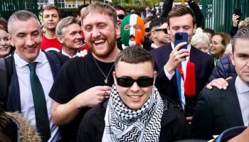 Kneecap's Liam Óg Ó Hannaidh, middle, leaves court on Sept. 26, following the dismissal of his terrorism charges for waving a Hezbollah flag were dismissed.