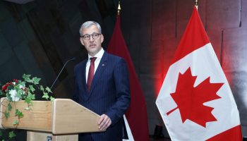 Latvian Ambassador Kaspars Ozolins delivers a speech at Latvia's national day party at the Canadian War Museum on Nov. 3, 2025. The Hill Times photograph by Sam Garcia