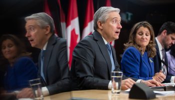 Ministers François-Philippe Champagne, left, Chrystia Freeland, and Sean Fraser speak with reporters at the National Press Theatre in Ottawa on Nov. 28, 2023, about the rollout of the government’s fall economic statement. Andrew Meade